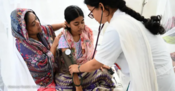 Female health provider with a mother and daughter