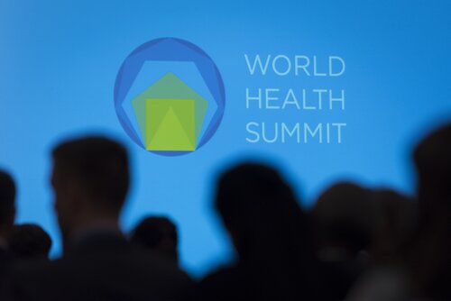 World Health Summit 2022 Logo. Blue background with people's silhouette in the foreground.